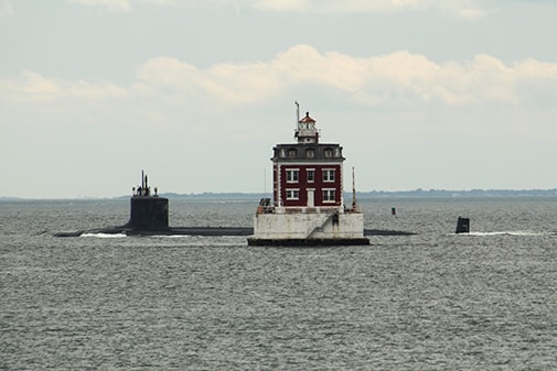 New London Ledge lighthouse with submarine passing by, Spring 2026